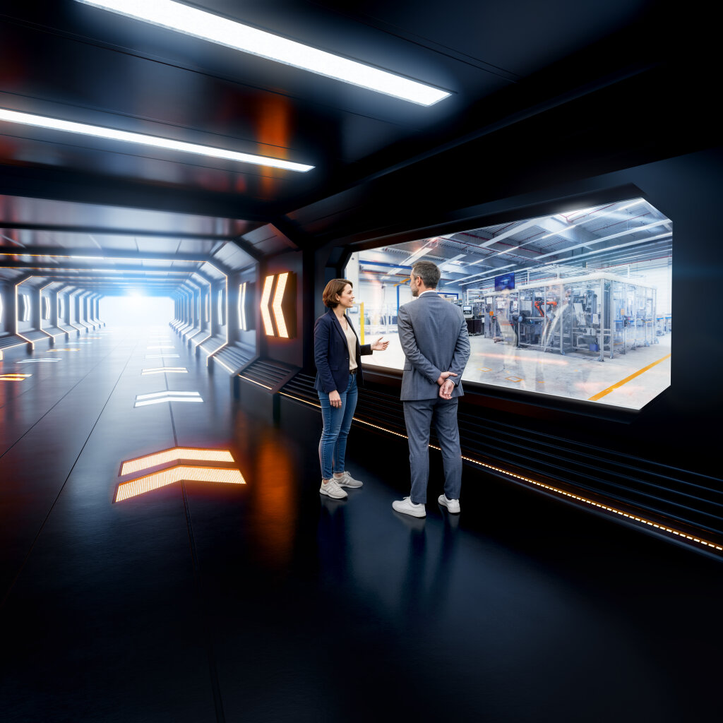 Zwei Personen betrachten eine moderne Industrieproduktion durch ein gro&szlig;es Sichtfenster in einer futuristischen Umgebung als Key Visual f&uuml;r Handtmann Systemtechnik.